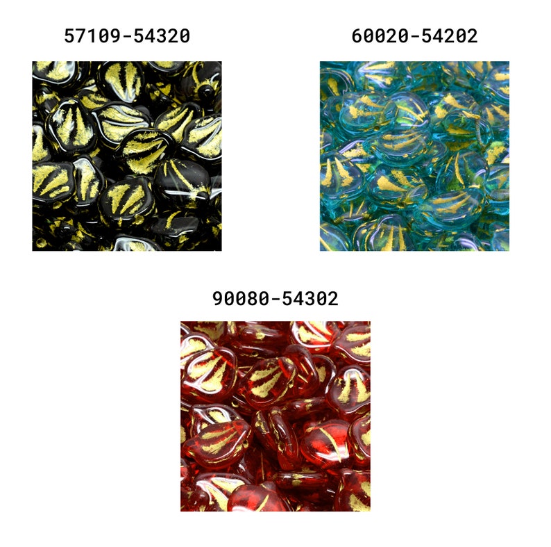 May include: A close-up of three different colors of glass heart-shaped beads. The beads are all translucent and have a gold leaf design. The colors are black, teal, and red.
