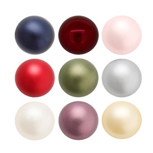 Może przedstawiać: Dziewięć okrągłych, gładkich, perłowych ozdób w różnych kolorach, w tym czerwonym, zielonym, różowym, białym i szarym. Ozdoby są ułożone w siatkę 3x3.