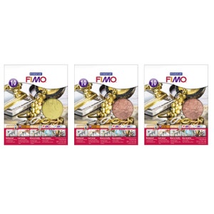Könnte beinhalten: Drei Packungen FIMO Modelliermasse, jede mit einer anderen Metallic-Farbe: Gold, Kupfer und Bronze. Jede Packung enthält einen 14x14cm (5,5x5,5 Zoll) großen Knetblock und ein dekoratives Bild von Schmuck und anderen metallischen Gegenständen.