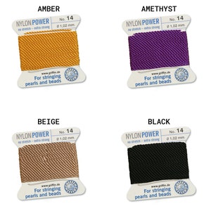 May include: Four spools of nylon power thread for stringing pearls and beads. The colors are amber, amethyst, beige, and black. Each spool is labeled with the brand name, "Nylon Power", the thread size, "No. 14", and the thread thickness, "0 1,02 mm".