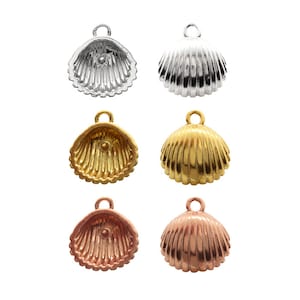 May include: Six shell-shaped charms in silver, gold, and rose gold. Each charm has a loop at the top for attaching to jewelry.