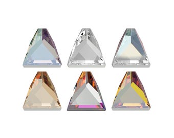 May include: Six triangular rhinestones in various colors, including clear, iridescent, and amber. The rhinestones are arranged in two rows of three.