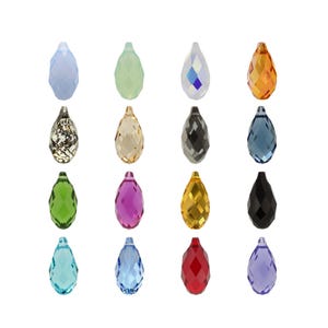 May include: A collection of sixteen faceted teardrop-shaped crystal pendants arranged in a four-by-four grid. The pendants feature a variety of colours including light blue, pale green, iridescent white, amber, metallic gold, black, dark blue, green, magenta, yellow, red, and purple.