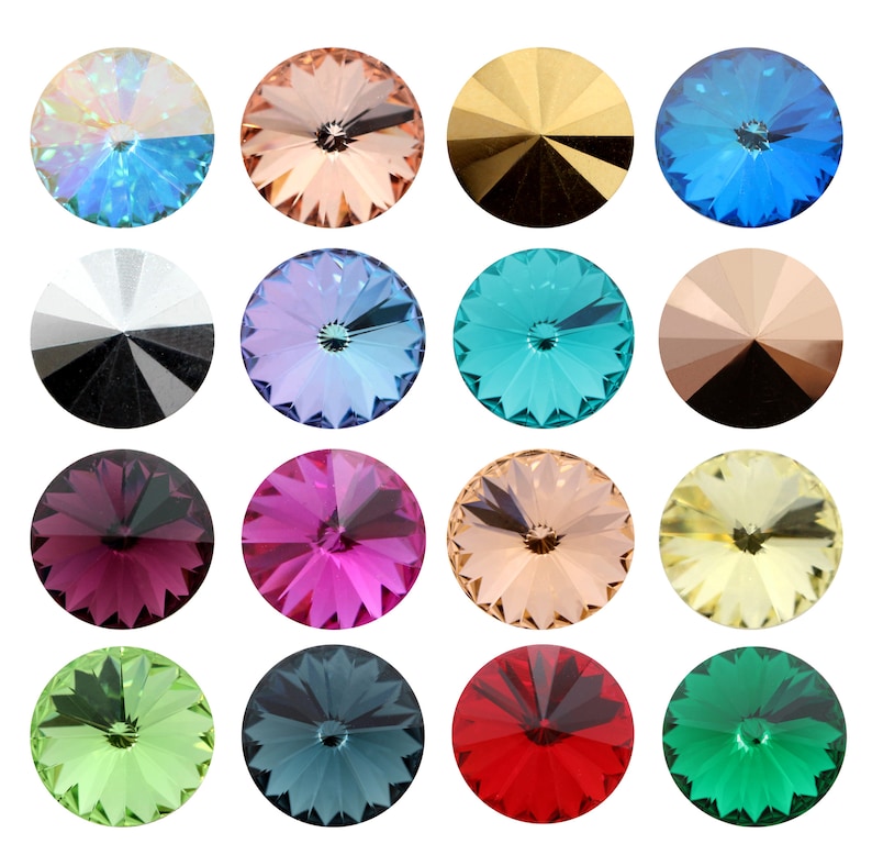 May include: Assortment of 15 round, faceted glass rhinestones in various colors, including blue, green, red, pink, and gold. Each rhinestone has a pointed center.