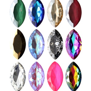 Könnte beinhalten: Zwölf markiseförmige Strasssteine in verschiedenen Farben, darunter Grün, Blau, Gold, Rot, Schwarz, schillernd, klar, Pink und Regenbogen.