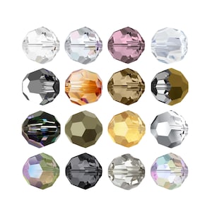 Pode incluir: Conjunto de 15 contas redondas de vidro em várias cores, incluindo transparente, preto, dourado, marrom e iridescente.