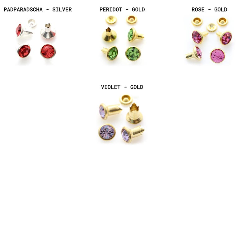 May include: Assortment of gold-tone metal settings with colorful rhinestones. The settings are for attaching rhinestones to fabric or other materials. The colors include red, green, pink, and purple.