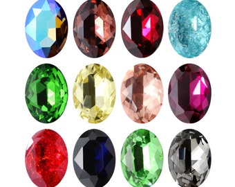 May include: Twelve oval-shaped gemstones in various colors, including red, green, blue, and yellow. The gemstones are arranged in three rows of four.