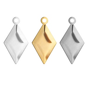 May include: Three diamond-shaped charms with a loop at the top. The charms are silver, gold, and a darker silver.
