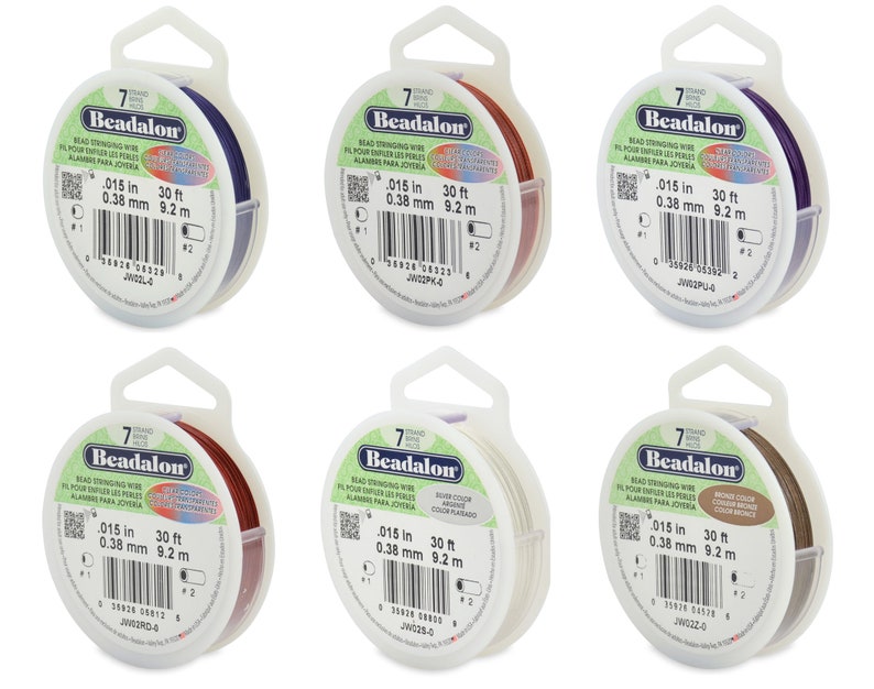 May include: Six spools of Beadalon bead stringing wire in various colors, including purple, silver, bronze, red, and white. Each spool is labeled with the brand name, wire size, and length in inches and millimeters. The spools are packaged in clear plastic containers with hang tags.