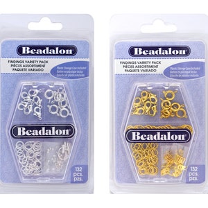 May include: Two packages of silver and gold jewelry findings. Each package contains 132 pieces and includes a plastic storage case. The packages are labeled "Beadalon Findings Variety Pack".