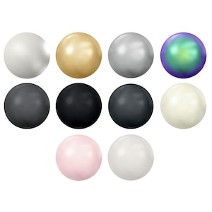 May include: A collection of ten spherical beads arranged in three rows. The colours include white, gold, silver, iridescent purple-green, dark grey, black, charcoal, cream, light pink, and light grey, all featuring a smooth, polished finish.