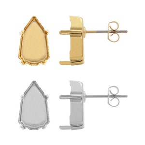 May include: Two pairs of earring settings, one gold and one silver. Each setting has a pointed oval shape with a scalloped edge and a post for attaching earrings.