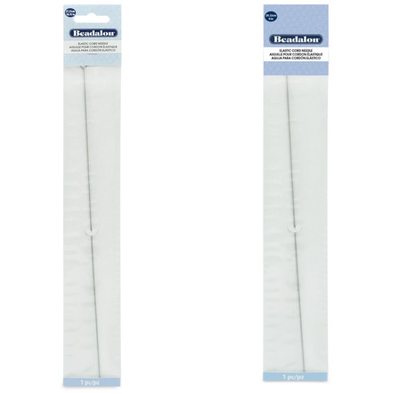 May include: Two packages of Beadalon elastic cord needles. Each package contains one needle and is labeled with the text "Beadalon Elastic Cord Needle" in English, French, and Spanish. The needles are silver and measure 25 cm in length.