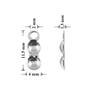 Puede incluir: Hallazgos de joyería plateados con tres secciones redondeadas y un lazo en la parte superior. Los hallazgos miden 11,5 mm de largo, 4 mm de ancho y 1,3 mm de grosor. El lazo tiene 2 mm de diámetro. La vista lateral muestra la forma redondeada.