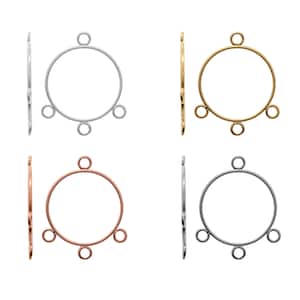 May include: Four round metal jump rings with three jump rings attached to each. The jump rings are silver, gold, rose gold, and black.