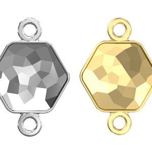May include: Two hexagonal crystal charms with a faceted design. One charm is silver and the other is gold. Both charms have a loop at the top for attaching to jewelry.