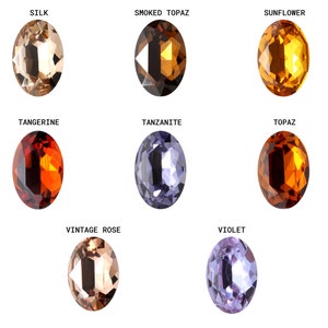 Pode incluir: Nove pedras preciosas ovais em v&aacute;rias cores, incluindo bege, marrom, laranja, amarelo, roxo e azul. As pedras preciosas s&atilde;o etiquetadas com seus nomes: Seda, Top&aacute;zio Fumado, Girassol, Tangerina, Tanzanita, Top&aacute;zio, Rosa Vintage e Violeta.