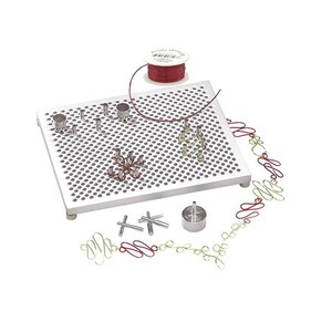 May include: A silver metal jewelry making tool with a gridded surface and various metal pieces. The tool is used to create wire jewelry. A spool of red wire is also included.
