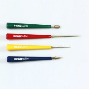 May include: Set of four Beadsmith diamond tipped tools. The tools are green, red, yellow, and blue. Each tool has a diamond tipped point and a handle with the Beadsmith logo.