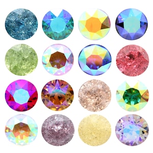 Pode incluir: Conjunto de 15 gemas redondas de vidro iridescente e fosco em várias cores, incluindo azul, verde, vermelho, laranja e roxo.
