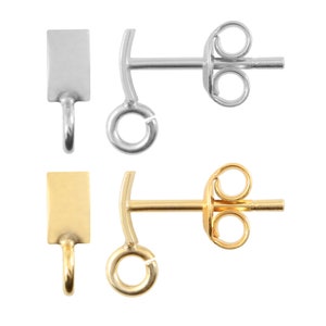 May include: Two pairs of earring findings, one pair is silver and the other is gold. Each finding has a square-shaped top and a loop on the bottom. The findings are designed to be attached to earrings.