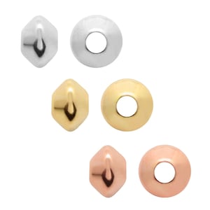 May include: Set of six round and faceted beads in silver, gold, and rose gold finishes. The beads have a hole in the centre for stringing.