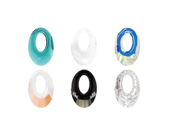 May include: Six oval-shaped crystal beads in various colors and finishes, including clear, white, black, blue, and green.