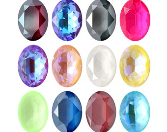 May include: Twelve oval-shaped gemstones in various colors, including red, blue, green, and purple. The gemstones are arranged in three rows of four.