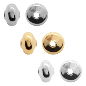 May include: Set of six metal bead caps in two finishes: silver and gold. Each cap has a round shape with a hole in the centre.