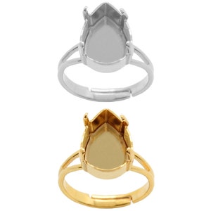 以下が含まれることがあります： 梨の形をしたセッティングが施された、調節可能なリングが2つ。1つのリングはシルバー、もう1つはゴールドです。