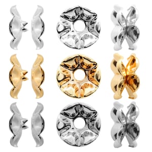 May include: Set of 9 silver, gold, and clear metal bead caps. Each cap has a flower-shaped design with a hole in the center.