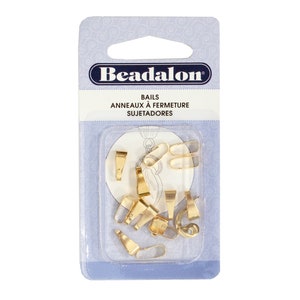 May include: A package of gold-colored bail closures for jewelry making. The package says "Beadalon Bails Anneaux à Fermeture Sujetadores".