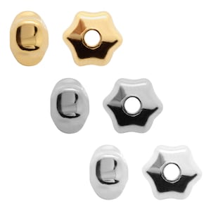 May include: Set of six metal bead caps, two gold, two silver, and two silver with a star shape.