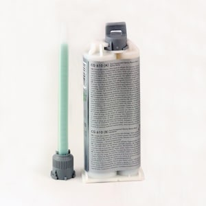 May include: Two-part epoxy resin glue in a silver tube with a green resin tube. The label reads "CG 610 (A) Two-Component Epoxy Resin Glue".