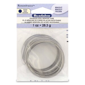 May include: A package of Beadalon stainless steel memory wire, 1 ounce (28.3 grams), for jewelry making. The wire is silver in color and is coiled in a circle.