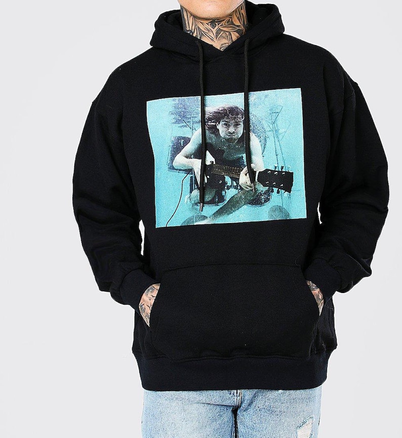 May include: Black hooded sweatshirt with a graphic print of a man playing a guitar underwater. The graphic is in a blue and green color scheme.