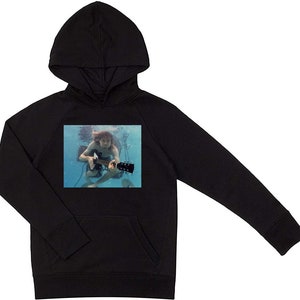 May include: Black hooded sweatshirt with a graphic print of a person playing a guitar underwater.