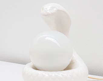 A vintage ceramic 'snake' table lamp