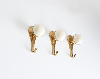 A set of 3 Italian Brass Coat Hooks, 1970s.