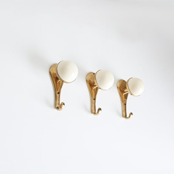 A set of 3 Italian Brass Coat Hooks, 1970s.