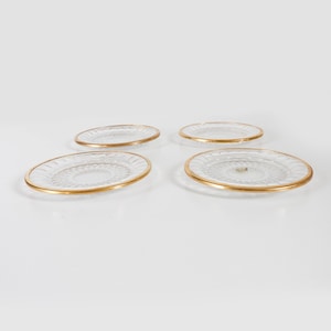 A Set of 4 Val Saint Lambert Plates with Gold Plated Details.