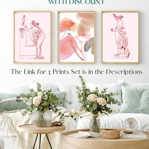 May include: Three framed prints with pink backgrounds. The first print features a line drawing of a woman holding a mirror. The second print features a watercolor painting of pink flowers. The third print features a line drawing of a woman holding a cup.