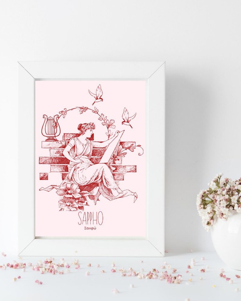 May include: A framed print with a pink background featuring a red line drawing of a woman sitting on a brick wall with a lyre behind her. The woman is holding a scroll and there are birds flying around her. The text "SAPPHO" and "&Sigma;&alpha;&pi;&phi;ώ" is below the image.