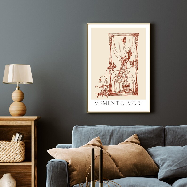 May include: A vintage-style print featuring a red hourglass, a skull, and a butterfly. The print has a cream background and the text "MEMENTO MORI" at the bottom.