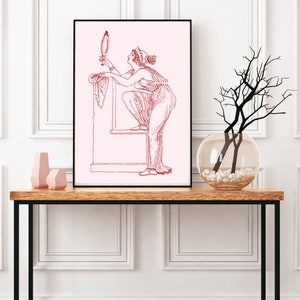 May include: A line drawing of a woman in a long dress looking at a hand mirror. The drawing is in red on a pink background.