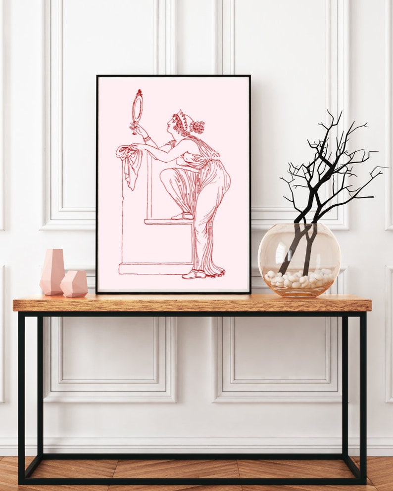 May include: A line drawing of a woman in a long dress looking at a hand mirror. The drawing is in red on a pink background.