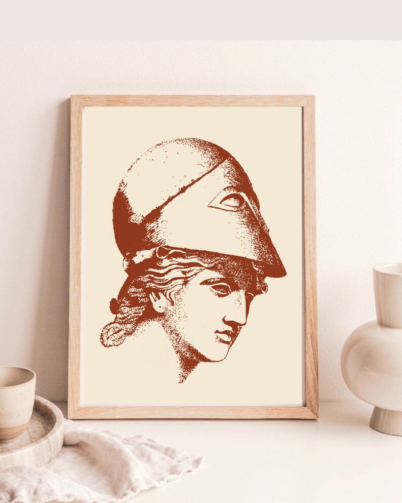 May include: A framed print of a vintage illustration of a woman's head wearing a helmet. The illustration is in shades of brown and cream.