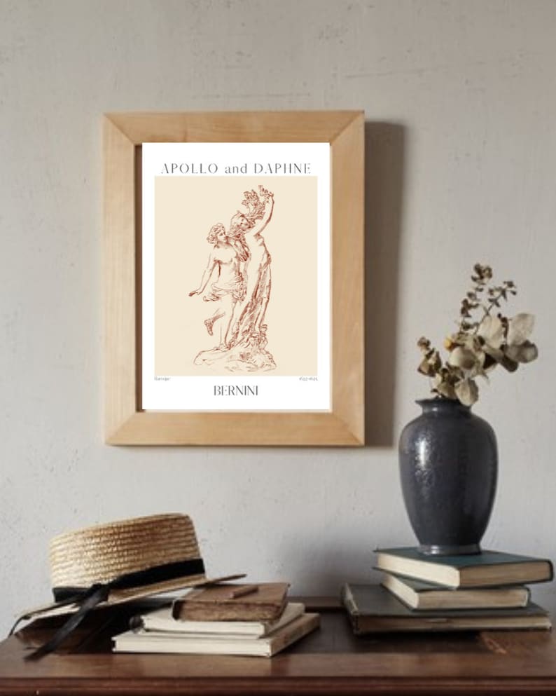 May include: A framed print of a line drawing of the sculpture "Apollo and Daphne" by Gian Lorenzo Bernini. The print is on a cream background with the title and artist's name in brown text.