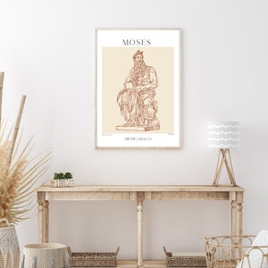 May include: A printable poster with a line drawing of the Moses sculpture by Michelangelo. The poster has a beige background with brown text that reads "MOSES" and "MICHELANGELO".